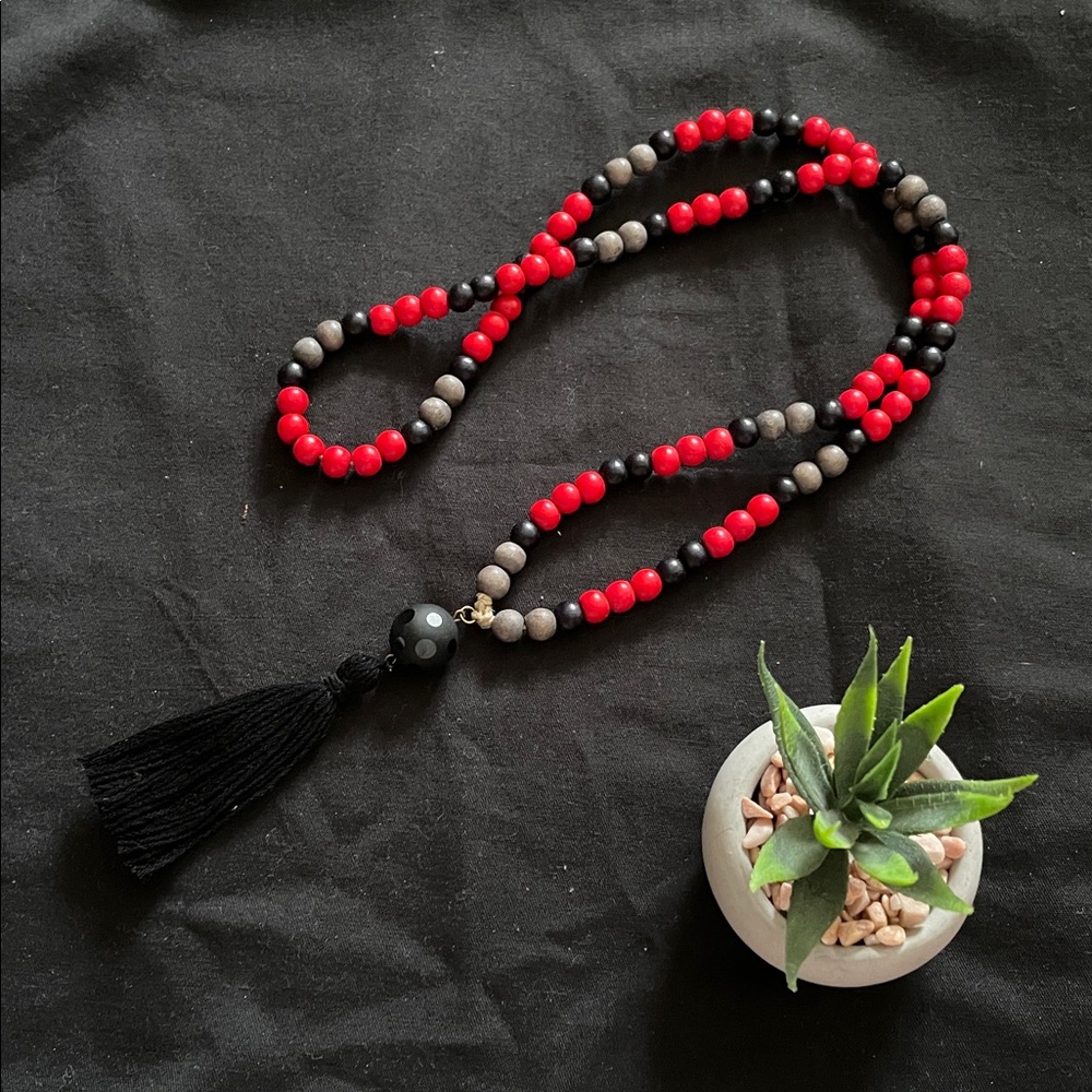Hand assembled beaded necklace - black tassel